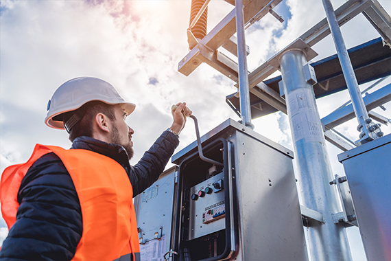 Engineer Operating High Voltage Outdoor Electrical Switch