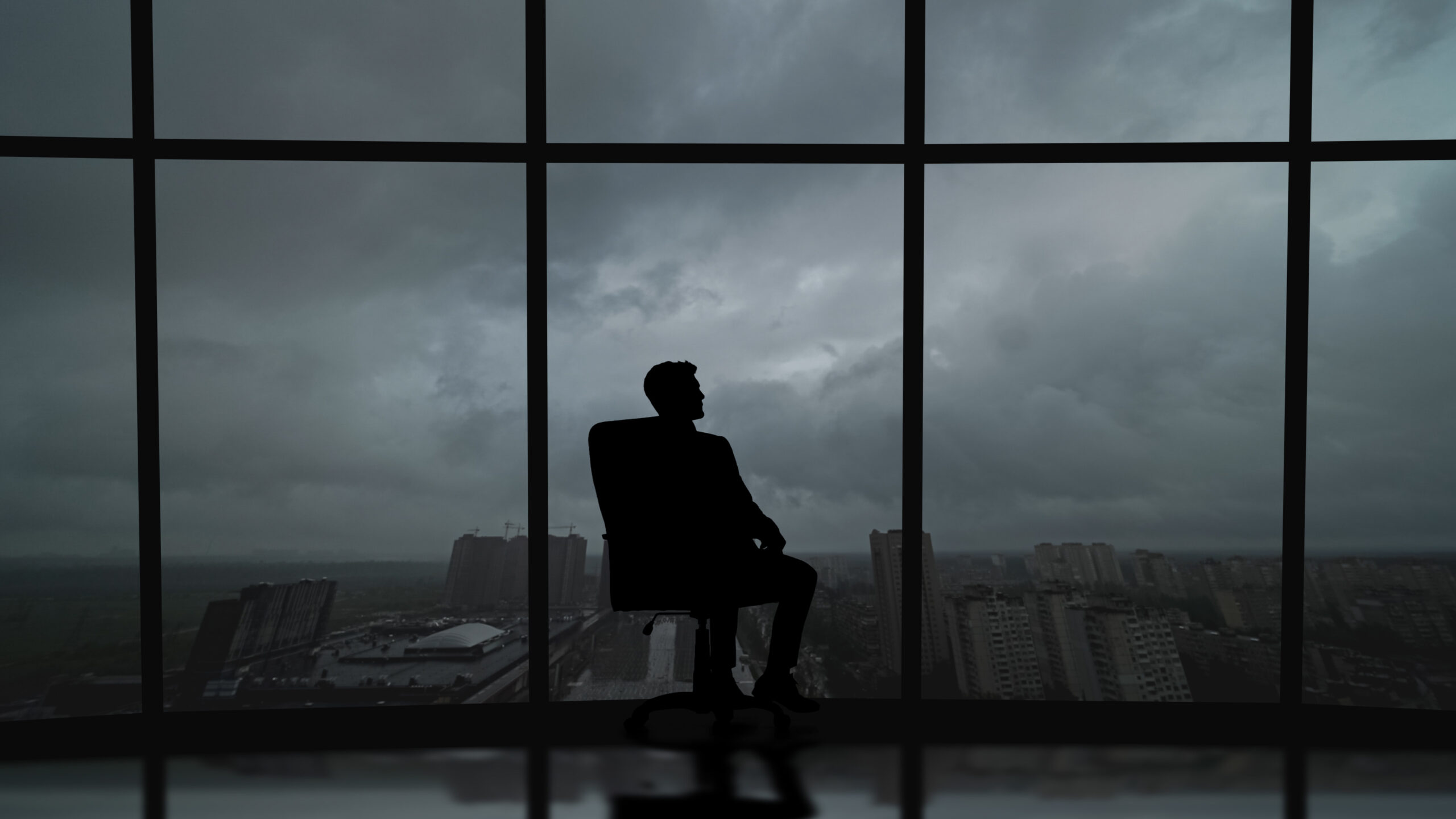 The Business Man Is Sitting In The Office Near The Window With A